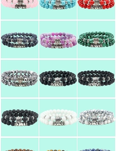 Collection of double-layer beaded bracelets with diverse natural stone colors and owl charms
