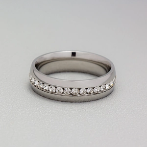 Close-up of a silver stainless steel eternity ring with a full circle of white zircons