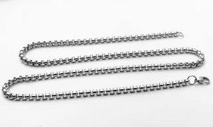 Detailed view of silver square box chain necklace with durable lobster clasp closure