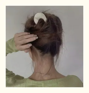 French style acetate U-shaped hair pin shown in a bun hairstyle for classic hair styling