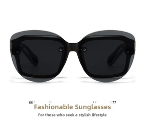 Detail view of cat eye sunglasses with grey lenses and double-layer metal rivet frames