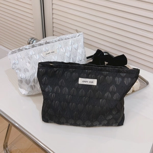 Minimalist heart jacquard cosmetic bag in silver and black with simple wish label