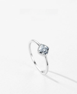 Macro shot of a minimalist S925 silver ring featuring a square-cut zirconia center stone