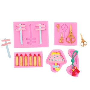 Pink silicone molds for DIY baking showing detailed scissors and umbrella shapes
