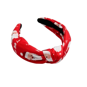Red knotted Christmas headband featuring Santa Claus prints and HO HO HO pattern