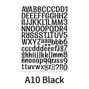 Macro detail of black vinyl letter stickers with alphabet, numbers and symbols