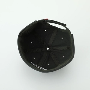 Close-up of black cotton miki hat featuring white weekend embroidery and inner lining detail