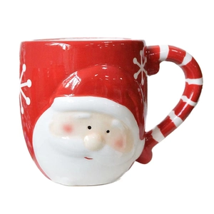 3D Santa Claus ceramic mug with red snowflake pattern and candy cane handle design