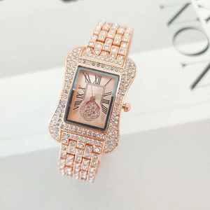 Rose gold rectangle watch for women with sparkling crystal accents and Roman numerals