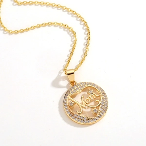 Detailed close-up of golden Mom pendant with sparkling star elements and micro-set zircons