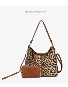 Detailed view of large leopard print tote bag and matching clutch pouch set