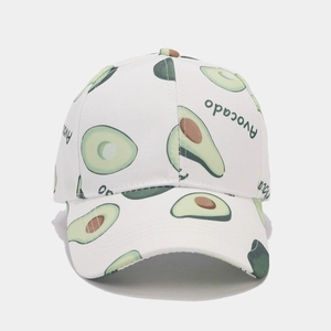 Detailed close-up of white canvas baseball cap with green avocado print and text
