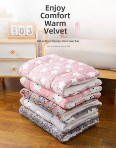 Stack of soft flannel pet blankets with star and bear patterns for cats and dogs