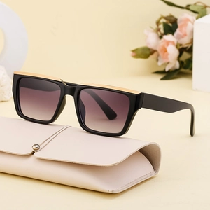Chic black square oversized sunglasses with gold metal trim and gradient purple lenses