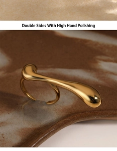 Detail of gold liquid style ring with double-sided high hand polishing on ceramic base