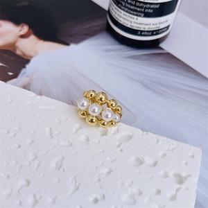 Elegant 18K gold-plated adjustable ring featuring white pearls and polished beads