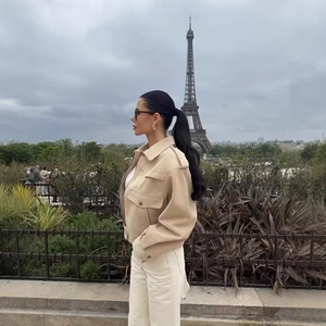 Beige suede jacket for women paired with white trousers, outdoor scene in Paris