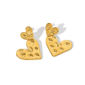 Detail of 18K gold-plated double heart earrings with hand-hammered textured finish