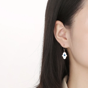 Minimalist Hamsa Hand drop earrings in gold finish featuring a blue Evil Eye shell design