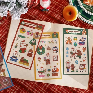 Transparent Christmas PET stickers for journals featuring Santa and festive patterns