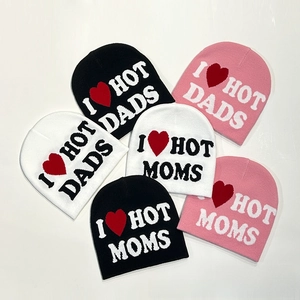 Detailed knit texture of hats with I Love Hot Dads letter jacquard and red heart design
