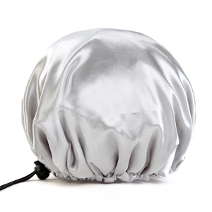 Detail of silver satin shower cap featuring soft PEVA lining and adjustable buckle
