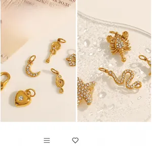Detailed view of various 18K gold plated charms with zircon crystals in star and heart shapes