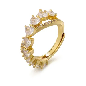 Elegant gold plated brass ring with sparkling heart-shaped zircon stones and open band