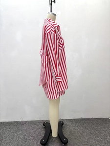 Detailed side view of red and white vertical striped long sleeve shirt and shorts set