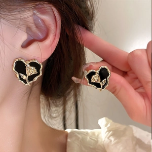 Vintage heart earrings with black enamel and embossed gold rose flower details