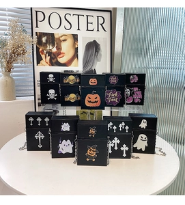Close-up of Halloween crossbody bag collection with skull and pumpkin prints