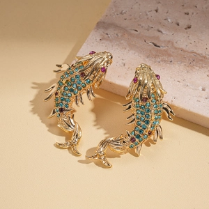 Detail showing koi fish earrings with turquoise rhinestones and gold plating finish