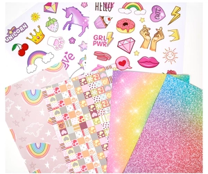 Close-up of glitter stickers and decorative papers with unicorn and rainbow patterns
