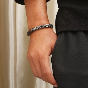 Men's punk Byzantine chain bracelet in dark stainless steel worn on the wrist