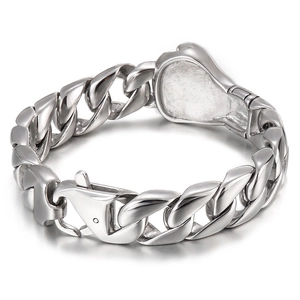 Heavy silver stainless steel Cuban link bracelet with large lobster clasp on white background