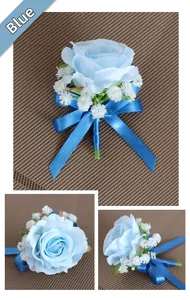 Detailed views of light blue artificial rose boutonniere with dark blue ribbon and baby's breath
