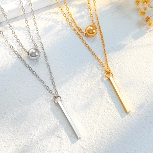 Double-layer necklace with sphere and vertical rectangular pendant in polished metal finish