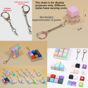 Mechanical switch fidget keychain with colorful keycaps on clear base and lobster clasp