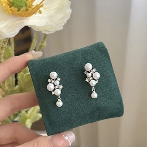 Detailed view of French Baroque style freshwater pearl earrings with diamond accents