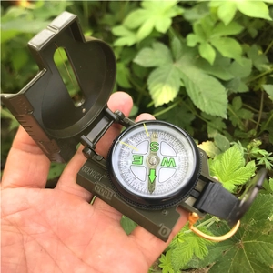 Handheld military style folding compass with aiming window and detailed map scales