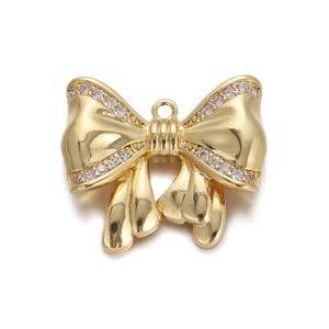 Detail of gold bow pendant with clear rhinestones and hanging loop for jewelry DIY