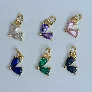 Six colorful teardrop zircon pendants with gold plating in a neat 2x3 grid display