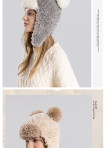 Detailed close-up of winter faux fur trapper hat with pom-pom and warm ear flaps