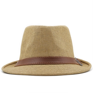 Detail of light brown straw fedora featuring a decorative brown faux leather band and buckle
