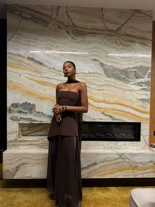 Detail of elegant dark brown tube top and slit maxi skirt set with matching neck scarf