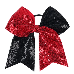 Détail d'un nœud papillon à paillettes rouge et noir avec élastique à cheveux haute qualité