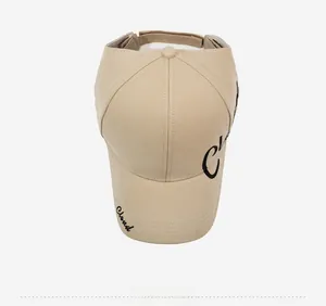 Detailed top view of beige sun visor hat featuring black Cloud embroidery and back strap