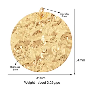 Close-up of golden hammered texture round pendant with 31mm width and 5mm top loop