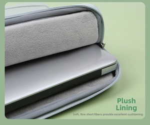 Detailed view of gray laptop sleeve with soft plush lining for scratch protection