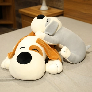 Detailed view of plush dog toy skin in brown and grey colors laying on cozy bedding